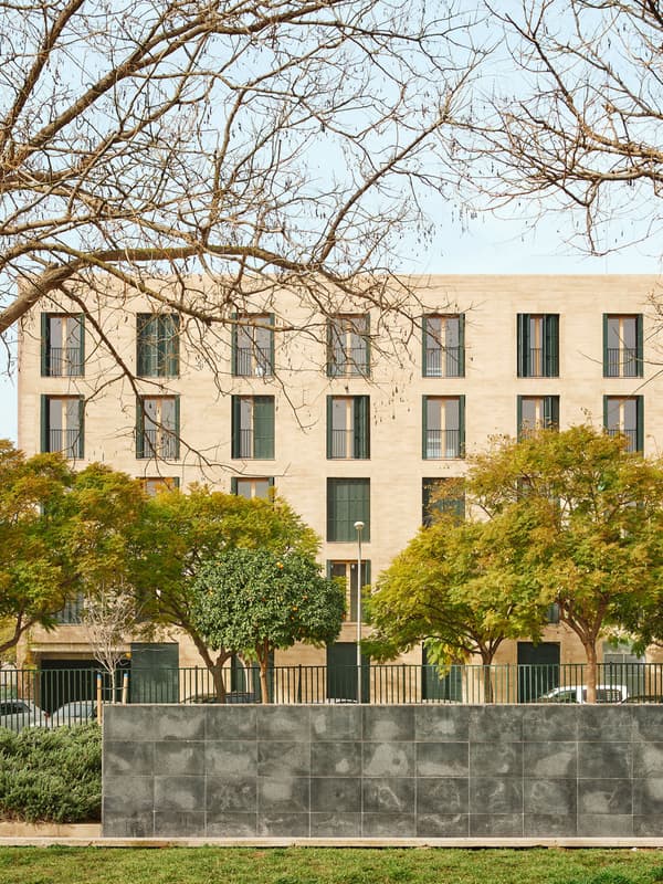 Architectural project - urban greenery, apartment facade, symmetrically placed windows, stone facade, greenery foreground, sophisticated facade, apartment block, beige facade, rhythmic pattern, vertical emphasis, property development, urban residence, linear design, urban trees, vibrant neighborhood, modern apartment, eco friendly material, city living, grey, cityscape, passive design, natural tones, contemporary architecture, sustainable architecture, green, urban planning, beige, concrete, minimalist facade, daylight optimization, public space, urban design, modern facade, landscape integration, elegant design, rectangular windows, stone, landscape design, exterior view, residential building, sustainable facade, textured facade, residential area, urban context, urban living, street view