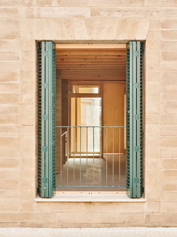 Architectural project - green shutters, terrace, balcony, open shutter, exposed timber, sand tone, natural facade, apartment entrance, clean architecture, urban dwelling, ecological home, interior transition, architectural detail, wood, timber, sustainable design, glass, warm tones, eco design, green, neutral tones, daylight, beige, light wood, rustic charm, light brown, minimalist design, exterior, cozy space, rammed earth, natural material, earthy texture, modern rustic, biophilic design, passive house, natural ventilation, timber cladding, textured wall, wooden interior, wood walls, inviting space, warm atmosphere, clay, Mediterranean style, exterior view, residential space, bright interior, simple lines