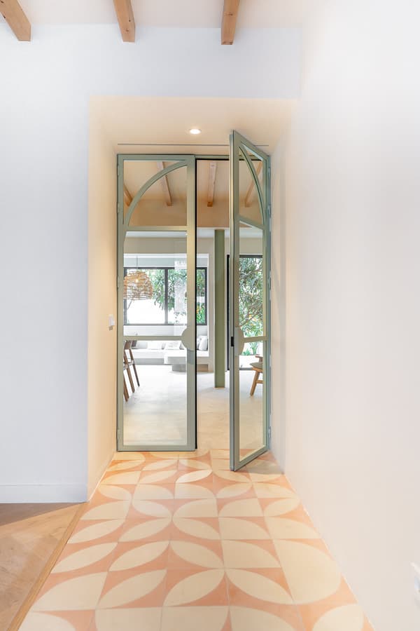 Architectural project - modern entrance, open doorway, transitional space, welcoming entrance, entrance, home entry, patterned tiles, double doors, pastel, geometric tiles, architectural detail, steel, natural light, glass, warm tones, beige, light wood, Scandinavian influence, timber beams, minimalist vibe, contemporary design, sleek lines, neutral palette, glass doors, steel frame, clean aesthetic, white, Nordic style, airy space, open plan, inviting space, bright interior, modern home, foyer, minimalistic style, entryway