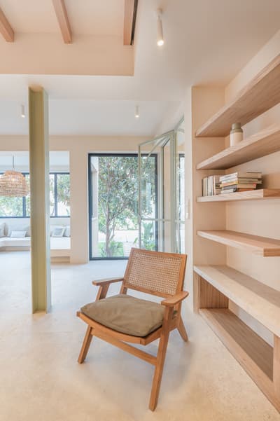 Architectural project - beige walls, cozy living, airy interior, functional decor, elegant simplicity, contemporary decor, timber details, accent chair, eco-friendly design, sustainable materials, relaxation area, natural light, warm tones, neutral tones, daylight, light wood, honey wood, serene atmosphere, Scandinavian style, calming space, minimalist design, glass doors, indoor outdoor, inviting home, Nordic style, wood accents, wood shelves, open shelves, open layout, open plan, earthy tones, nature-inspired, organic materials, tranquil vibe, cozy corner, garden view, modern living room, reading nook, residential space, modern home, bright space, timeless design, sliding doors, plaster walls, comfortable living, minimal decor, simple lines, clean design, understated elegance, Japandi style