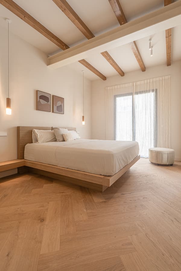 Architectural project - pendant lights, airy room, white bedding, modern bedroom, spacious room, natural materials, tranquil space, wood, timber, natural light, warm tones, eco design, neutral tones, exposed beams, daylight, beige, brown, simple design, wood beams, Scandinavian style, relaxation, neutral palette, soft textures, sustainable home, white, cozy vibe, open plan, inviting space, timber flooring, wooden elements, calm atmosphere, nordic influence, oak, light wood flooring, minimalist bedroom, bedroom sanctuary, Japandi style