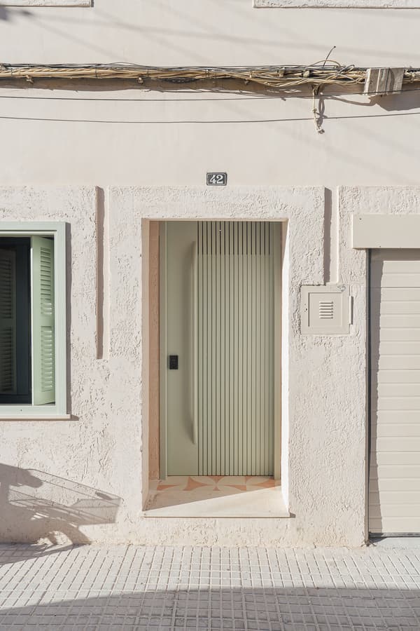 Architectural project - linear design, vertical lines, minimalist door, sleek look, geometric shapes, welcoming entrance, southern style, mint green, stucco wall, warm climate design, street facade, exterior renovation, pastel, passive design, green, beige, concrete, minimalist facade, contemporary design, neutral palette, pastel green, soft textures, light tones, modern facade, clean lines, white, home facade, architectural details, textured wall, plaster wall, energy efficient, plaster, Mediterranean style, subtle texture, sustainable facade, textured facade, soft tones, facade renovation, urban home, residential facade, urban exterior, entryway