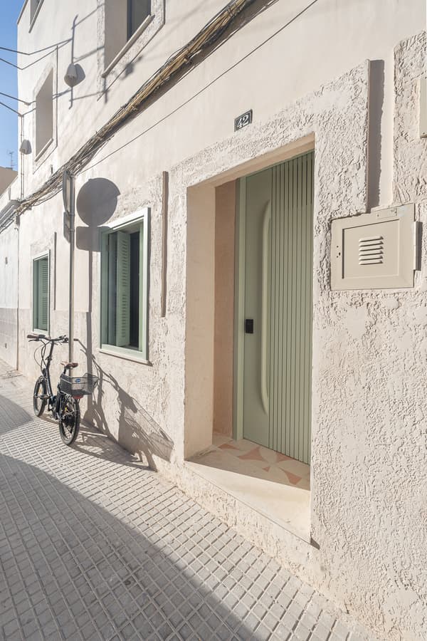 Architectural project - minimalist home, street scene, stucco wall, suburban style, cozy facade, minimal design, architectural detail, natural light, eco design, neutral tones, exterior design, exterior wall, minimalist vibe, modern simplicity, urban design, pastel green, light tones, clean lines, textured wall, residential design, residential architecture, textured facade, seamless integration, simple architecture, soft light, understated elegance, residential facade, urban facade, urban living, street view, urban vibe