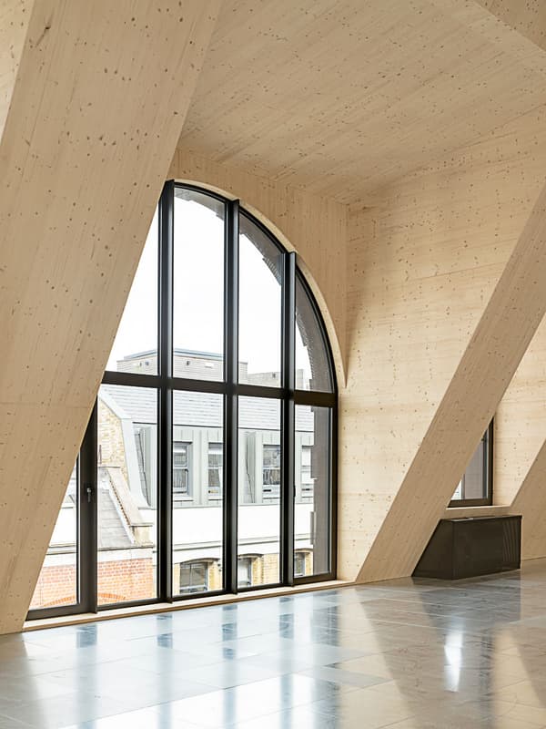 Architectural project - floor to ceiling windows, commercial space, urban loft, arched windows, city view, cream, modern office, architectural beams, warm interior, natural materials, architectural detail, wood, timber, raw materials, steel, natural light, sustainable design, glass, warm tones, eco design, neutral tones, exposed beams, daylight, beige, light wood, contemporary design, industrial touch, Scandinavian style, neutral palette, minimalist design, timber walls, workspace, structural beams, biophilic design, passive house, modern architecture, Nordic style, wood walls, timber ceiling, timber interior, open plan, inviting space, bright space, wood ceiling, open space, pale wood, high ceiling, double height, wood interior, urban view