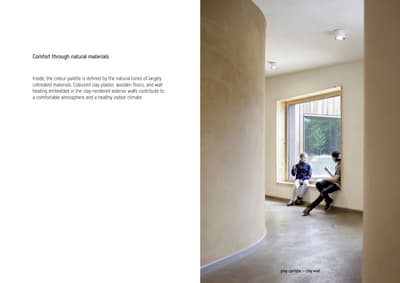 Architectural project - warm interior, natural materials, soft lighting, wood, timber, raw materials, grey, passive design, sustainable design, eco design, neutral tones, daylight, beige, peaceful setting, contemporary interior, minimalist design, casual seating, relaxed atmosphere, natural ventilation, large window, plaster wall, plaster, cozy nook, clay, natural texture, cozy corner, reading nook, seating area, residential space, curved wall, minimal corridor, simple hallway, relaxed ambiance, modern natural, soft light, clay wall, window seat, welcoming space, laid-back vibe, inviting environment, wellness focused, indoor air quality, healthy building, home corridor, modern comfort, serene interior