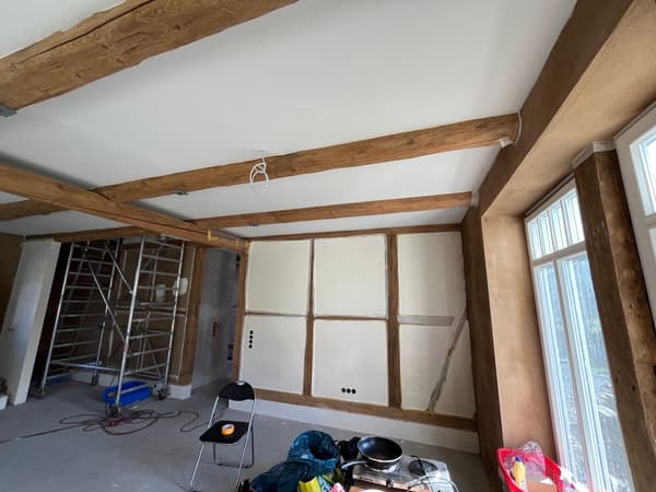 Architectural project - rustic interior, informal space, refurbishment, renovation project, interior construction, unfinished walls, cozy interior, warm interior, wood, timber, scaffolding, natural light, neutral tones, work in progress, exposed beams, ceiling beams, daylight, gathering space, beige, brown, light wood, natural wood, simple design, honey wood, wood beams, timber beams, rustic modern, minimalist design, casual space, adaptive reuse, light tones, modern rustic, project site, white walls, light filled, white, inviting home, plaster, family space, plaster walls, open space, cozy home, structural elements, eco renovation, sustainable renovation, construction, renovation, home renovation