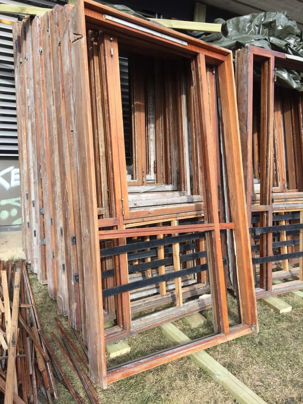 Architectural project - construction elements, stacked wood, reclaimed timber, reclaimed wood, wood frames, salvaged materials, recycled wood, reclaimed construction, rustic materials, rustic wood, timber stack, carpentry materials, renovation materials, upcycled wood, wood boards, building frames, raw surfaces, industrial materials, outdoor storage, material storage, raw timber look, basic materials, timber recycling, timber reuse, rustic frames, construction supplies, raw tones, exterior use, outdoor materials, storage setup, natural materials, sustainable materials, wood, timber, sustainable design, green building, sustainable architecture, neutral tones, construction site, building site, beige, brown, natural wood, eco friendly, rustic vibe, natural textures, eco construction, raw timber, earthy tones, wooden panels, timber frames