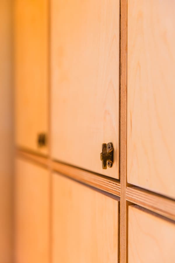 Architectural project - cozy feel, seamless look, cabinet, wood cabinet, minimalist cabinet, modern cabinetry, storage solution, functional furniture, plywood texture, concealed storage, subtle details, tidy space, organized living, light-toned wood, bright ambiance, natural materials, sustainable design, warm tones, contemporary style, neutral tones, plywood, light wood, eco friendly, simple design, honey wood, wooden detail, minimalist design, natural finish, clean lines, Nordic style, warm ambiance, compact design, inviting space, wood grain, Scandinavian design, built-in storage, modern minimalist, storage unit, smooth finish