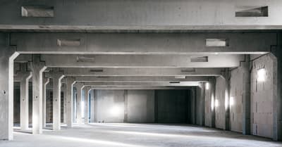 Architectural project - exposed concrete, flexible space, warehouse style, modern industrial, industrial interior, loft style, commercial space, unfinished look, airy interior, rugged texture, concrete texture, concrete walls, concrete interior, brutalist design, brutalism, large space, grey tones, utilitarian design, natural light, exposed structure, contemporary architecture, grey, neutral tones, functional space, daylight, industrial vibe, concrete, minimalist vibe, neutral palette, minimalist design, structural beams, white, raw finish, interior, urban architecture, public building, industrial space, structural rhythm