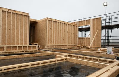 Architectural project - architecture in progress, OSB, home build, natural materials, wood, timber, scaffolding, timber frame, natural tones, modular design, sustainable construction, construction phase, construction site, work in progress, under construction, daylight, plywood, construction process, construction materials, construction industry, building site, structural design, light wood, engineered wood, eco friendly, eco building, minimalist structure, industrial site, exposed wood, circular construction, low carbon, wood frame, open plan, prefabrication, structural framework, building project
