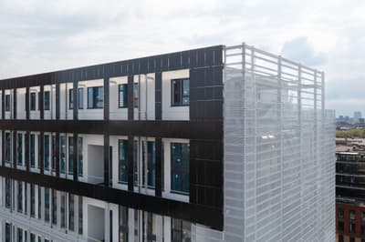 Architectural project - contrast design, vertical lines, metal cladding, metal facade, climate responsive, horizontal lines, commercial building, industrial look, grid pattern, black facade, modern office, office building, business center, urban setting, grey tones, steel, metal, natural light, glass, modular design, contemporary architecture, innovative design, modern vibe, sustainable architecture, neutral tones, industrial style, black, geometric design, modern facade, white facade, large windows, white, energy efficient, glass windows, eco architecture, sleek design, urban architecture, facade design, daylighting, dynamic facade, urban vibe, cityscape view, high-rise building, office space