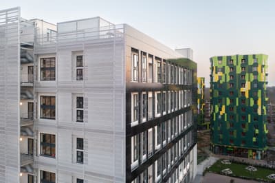 Architectural project - metal facade, colorful building, urban renewal, vibrant facade, cladding, vertical design, visual impact, high rise, contrast colors, city living, cityscape, outdoor space, sustainable design, green building, outdoor area, urban landscape, contemporary style, sustainable architecture, urban development, urban design, eco building, ecological design, green architecture, modern facade, energy efficient, residential building, urban architecture, innovative materials, facade design, modern exterior, residential area, community housing, innovative architecture, architectural contrast, dynamic facade, urban living, modern city, green wall
