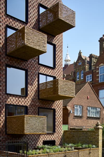 Architectural project - natural materials, architectural detail, urban setting, cityscape, outdoor space, sustainable design, warm tones, modular design, sustainable construction, urban landscape, city architecture, beige, brown, exterior design, geometric design, modern facade, modern architecture, brick facade, residential architecture, eco-friendly building, eco architecture, residential building, textured facade, modern living, innovative facade, facade design, apartment building, unique facade, residential block, creative balconies, exterior pattern, woven art, textured brick, artistic architecture, urban apartment, brick building, city dwelling, urban living, brown brick, woven texture, modern city, architectural innovation, woven balconies, contemporary building, modern residential, brickwork pattern, artistic facade, woven design, outdoor balconies, architecture contrast