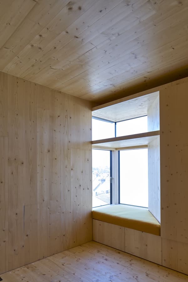 Architectural project - indoor space, wood, timber, natural light, sustainable design, glass, warm tones, neutral tones, daylight, wooden ceiling, timber ceiling, beige, brown, light wood, natural wood, eco friendly, honey wood, Scandinavian style, minimalist design, serene space, simple space, timber walls, modern minimalism, clean lines, Nordic design, cozy vibe, large window, cozy nook, compact design, timber interior, cozy corner, reading nook, residential space, bright interior, modern home, calm atmosphere, floor-to-ceiling window, home interior, airy feel, window seat, warm, wooden walls, wood interior, minimal space, inviting corner, simple finishes, bright, airy, relaxing, peaceful interior