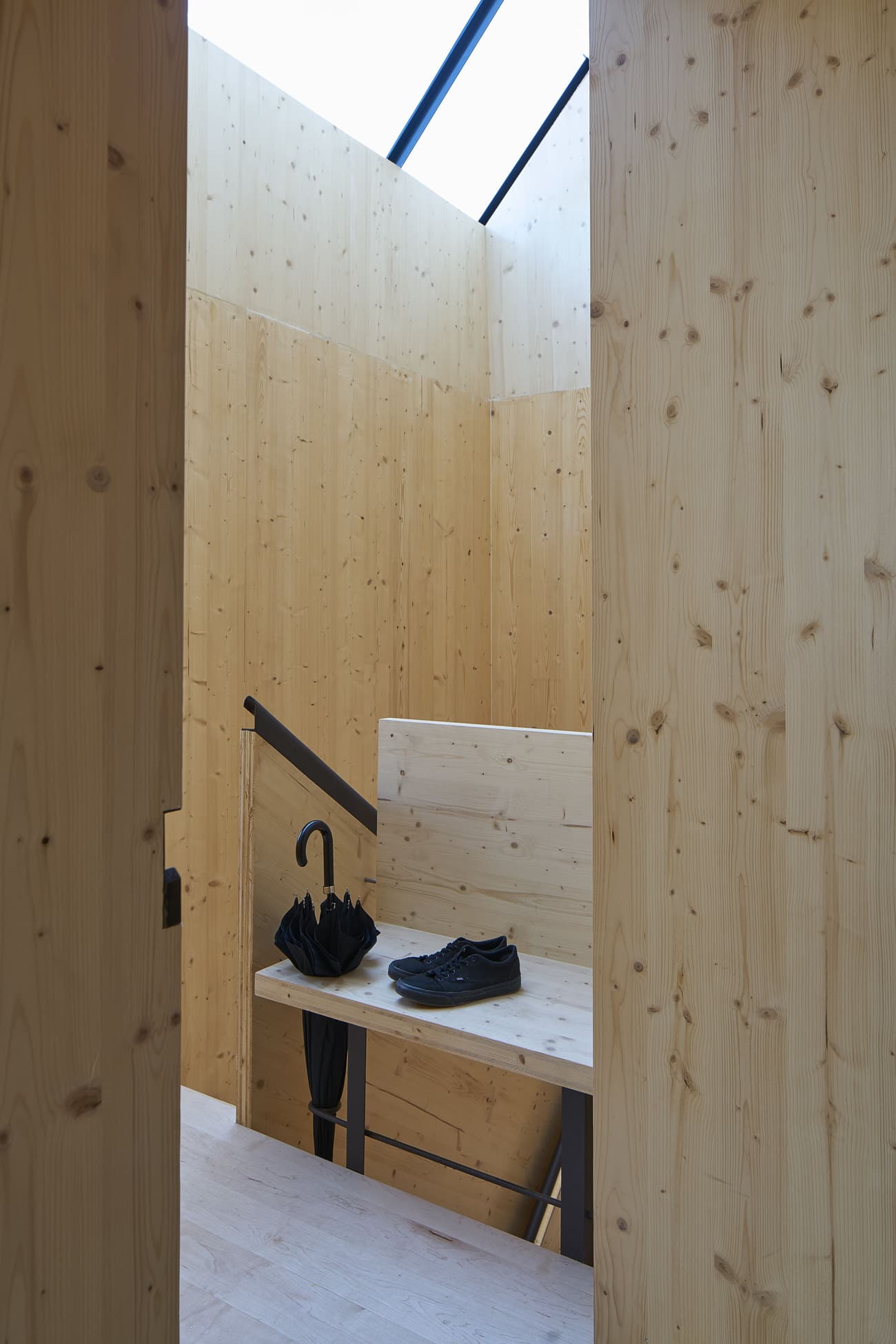 Architectural project - warm interior, natural materials, architectural detail, natural light, rustic touch, sustainable design, warm tones, structural timber, daylight, beige, light wood, natural wood, multifunctional space, functional design, eco friendly, honey wood, neutral palette, contemporary interior, minimalist design, Scandinavian vibe, cozy space, raw wood, light tones, exposed wood, modern rustic, biophilic design, passive house, timber cladding, wood cladding, simple elegance, Nordic style, cozy nook, inviting space, residential design, bright interior, earthy textures, home interior, open space, vertical slats, hallway, wood paneling, timber paneling, interior architecture, skylight, stairwell, indoor staircase, wooden stair, timber stair, relaxation corner, entryway, renovating ideas