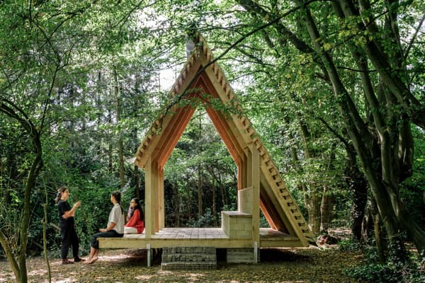 Architectural project - natural materials, wood, timber, timber frame, natural light, outdoor living, passive design, sustainable design, warm tones, green building, community space, neutral tones, daylight, gathering space, landscape architecture, light wood, open structure, eco structure, simple design, wood beams, rustic charm, minimalist design, social space, wooden pavilion, outdoor seating, eco-friendly structure, pitched roof, forest setting, triangular roof, tranquil vibe, nature connection, nature retreat, peaceful retreat, natural environment, forest shelter, pavilion design, outdoor shelter, airy pavilion, woodland hideaway, serene setting, surrounding trees, woodland scene, outdoor architecture
