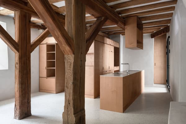 Architectural project - Scandinavian touch, countryside vibe, wooden kitchen, rustic beams, sleek kitchen, wooden island, country kitchen, wooden cabinets, boxy kitchen, speckled floor, rural kitchen, country charm, warm interior, natural materials, wood, timber, raw materials, inviting atmosphere, sustainable design, warm tones, neutral tones, exposed beams, beige, concrete, compact space, farmhouse style, wood beams, timber beams, rustic charm, neutral palette, minimalist design, clean aesthetic, cozy space, eco-friendly materials, light tones, warm wood, raw timber, earth tones, modern rustic, white walls, white, timber ceiling, cozy kitchen, unfinished wood, minimalist aesthetic, kitchen island, nordic influence, earthy textures, wood ceiling, concrete floor, functional kitchen, wood textures, simple lines, rustic kitchen, warm palette, practical layout