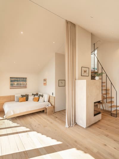 Architectural project - refined style, smart design, metal stairs, warm bedroom, floor-to-ceiling curtains, soft furnishings, modern bedroom, light wood floor, floating stairs, tranquil interior, intimate space, serene vibe, eco-friendly design, wood, timber, natural light, passive design, neutral tones, functional space, daylight, beige, light wood, Scandinavian style, timber floor, neutral palette, minimalist design, sustainable home, elegant design, white, Nordic style, energy efficient, beige tones, open layout, relaxing space, wooden flooring, bright interior, calm atmosphere, soft tones, wooden stairs, bedroom retreat, cozy bedroom, Japandi style, minimalist interior, residential interior