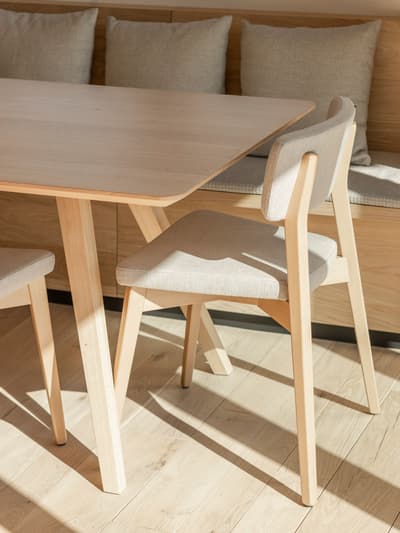 Architectural project - family dining, home dining, cozy dining, timber texture, oak wood, kitchen corner, sustainable furniture, wooden bench, wood, timber, relaxed vibe, natural light, natural tones, neutral tones, light wood, eco friendly, compact space, simple design, rustic modern, Scandinavian style, timber floor, wooden floor, minimalist design, modern rustic, clean lines, inviting home, Nordic style, beige tones, small space, informal dining, dining area, dining table, wood texture, warm atmosphere, casual dining, cozy corner, sunlit, earthy palette, breakfast nook, bright space, pale wood, parquet flooring
