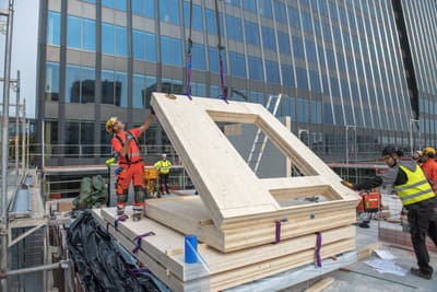 Architectural project - plywood panel, natural materials, sustainable materials, modular construction, prefabricated building, modular design, contemporary architecture, urban landscape, engineered timber, construction site, construction workers, urban construction, safety gear, assembly process, construction technique, urban development, teamwork, urban environment, building site, beige, light wood, low carbon design, innovative building, timber construction, eco materials, wood construction, sustainable building, eco construction, cross laminated timber, construction technology, modern architecture, engineering, prefabrication, structural panel, glass facade, wood panel, modern city, architectural innovation, high-rise building