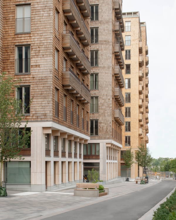 Architectural project - urban greenery, multi-story building, residential complex, vertical lines, pedestrian area, welcoming entrance, gathering spot, green city, sustainable urban, built environment, natural materials, timber, city living, eco design, community space, contemporary architecture, urban landscape, sustainable architecture, neutral tones, urban development, city architecture, beige, brown, concrete, timber facade, exterior design, light wood, geometric design, modern facade, wood cladding, brick, brick facade, balcony design, earthy textures, facade design, residential area, apartment building, modern urban, urban living, street view, outdoor balconies, high-rise building