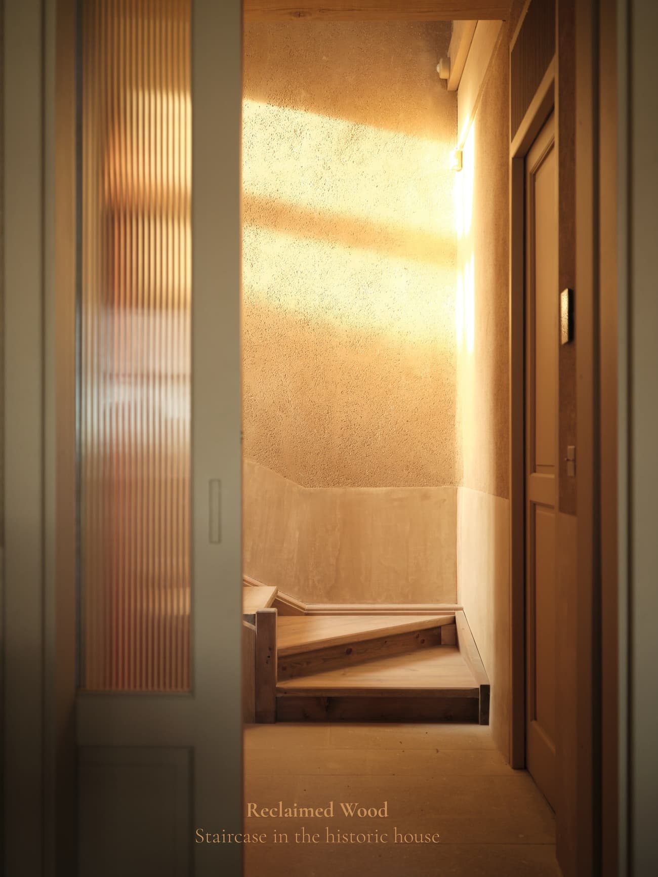 Architectural project - vertical lines, tan, intimate atmosphere, architectural interest, reclaimed wood, traditional aesthetics, narrow space, historic house, historic charm, rustic staircase, wood stair, quiet home, slide door, nostalgic vibe, wabi-sabi, introspective space, refined design, serene staircase, natural materials, soft lighting, eco-friendly design, wood, natural light, warm tones, intimate corner, beige, rustic charm, minimalist design, serene space, low carbon footprint, wood floor, earthen wall, sustainable home, textured wall, plaster wall, plaster, private nook, cozy atmosphere, simple lines, Japanese style, staircase