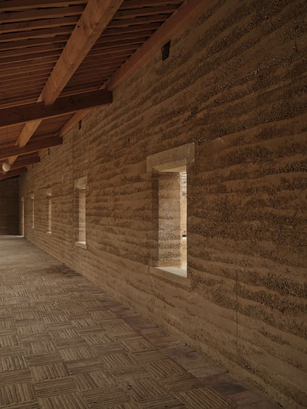 Architectural project - contemporary rustic, traditional craft, linear windows, strip windows, artisan feel, earthen colors, earthy architecture, countryside feel, tradition meets modern, warm interior, natural materials, wood, timber, raw materials, natural light, sustainable design, sustainable architecture, exposed beams, daylight, beige, brown, eco friendly, timber beams, organic design, rustic charm, neutral palette, cozy space, eco construction, natural building, rammed earth wall, earth tones, biophilic design, passive house, textured wall, beige tones, inviting space, earthy tones, warm atmosphere, rustic design, handcrafted, rural style, wooden roof, warm vibe, craftsmanship, earthy textures, modern nature, wood ceiling, sustainable living
