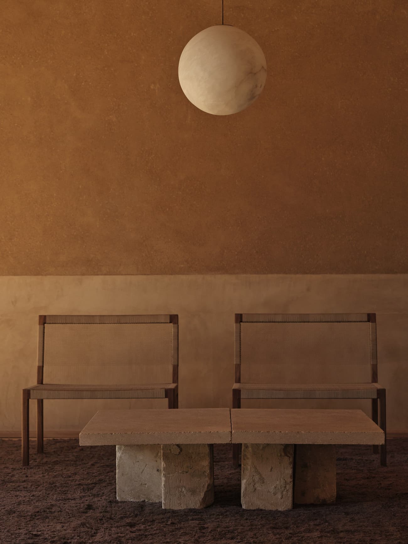 Architectural project - monochromatic scheme, rustic elegance, clay walls, calm space, stone finish, minimalist furniture, organic feel, zen vibe, beige shades, rustic seating, wood chairs, stone table, spherical lamp, subdued lighting, neutral design, meditation space, tactile space, tranquil room, relaxation space, warm interior, natural materials, serene environment, sustainable design, Scandinavian influence, rustic modern, natural textures, intimate setting, minimalist style, eco materials, modern rustic, plaster wall, hygge atmosphere, earthy vibe, earthy tones, clay finish, cozy atmosphere, textured walls, simple decor, pendant light, wooden furniture, brown tones, warm palette, Japandi style, textured rug
