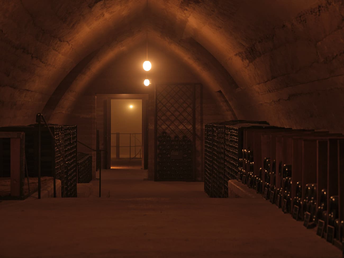 Architectural project - natural stone, dark ambiance, warm glow, stone walls, historic vibe, vintage feel, luxurious storage, cellar design, wine heritage, ambient lighting, subdued atmosphere, crafted environment, wine cellar, underground cellar, wine storage, wine racks, quiet space, wine collection, vault design, arch ceiling, stone vault, bottle storage, moody lighting, dim light, archway entrance, storage room, cellar arch, niche storage, private space, wine preservation, sommelier space, secluded room, architectural vault, secluded atmosphere, intimate cellar, intimate space, warm tones, beige, brown, rustic style, earthy tones, traditional design, cozy atmosphere, tranquil environment, timeless design, artisanal touch, stone texture