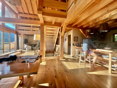 Architectural project - mountain view, breakfast bar, timber floors, hygge, comfort living, Scandinavian cabin, timber home, open staircase, warm interior, natural materials, wood, timber, natural light, passive design, glass, warm tones, exposed beams, daylight, beige, brown, light wood, golden, eco friendly, sunlight, honey wood, timber beams, rustic modern, light brown, casual seating, scenic view, indoor outdoor, Nordic design, energy efficient, rustic cabin, open layout, open plan, inviting space, casual dining, nature-inspired, wooden flooring, wooden cabin, vacation home, home office, bright interior, family home, kitchen island, earthy textures, cozy home, airy atmosphere, sustainable living, sloped ceiling, high ceiling, wood interior