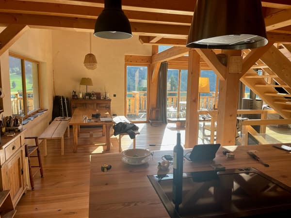 Architectural project - hygge, rustic furniture, kitchen area, country style, relaxation space, cozy interior, natural materials, wood, timber, timber frame, relaxed vibe, natural light, warm tones, eco design, exposed structure, exposed beams, daylight, beige, golden, farmhouse style, rustic vibe, honey wood, wood beams, Scandinavian style, timber floor, wooden floor, wood floor, scenic view, Nordic style, plaster wall, plaster, countryside view, rustic cabin, open layout, open plan, family space, dining area, dining table, inviting space, warm atmosphere, casual dining, wooden cabin, green design, earthy textures, wood ceiling, cozy home, indoor, sustainable living, rural retreat, natural home