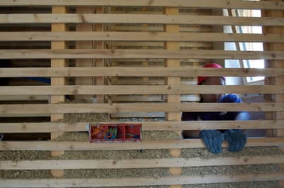 Architectural project - exposed timber, straw, unfinished wall, timber texture, earthy design, hand-built, rustic construction, renewable resources, natural materials, eco-friendly design, wood, timber, timber frame, green building, sustainable architecture, renewable materials, neutral tones, construction process, building site, wood framework, beige, vernacular architecture, wood structure, sustainable building, eco construction, circular construction, biophilic design, rural construction, passive house, energy efficient, natural texture, low carbon building, timber wall, straw insulation, natural insulation