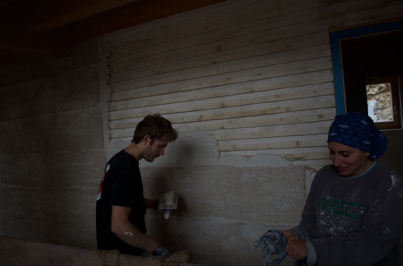 Architectural project - wood wall, casual vibe, DIY project, manual work, sustainable build, natural design, timber texture, farmhouse vibe, country style, texture wall, renovation project, rustic construction, natural materials, wood, timber, sustainable design, warm tones, grey, work in progress, construction process, construction materials, beige, casual setting, neutral colors, earth-friendly, rustic finish, plaster wall, plaster, rustic style, earthy tones, textured finish, cozy atmosphere, plaster texture, timber wall, eco renovation, home improvement, home renovation