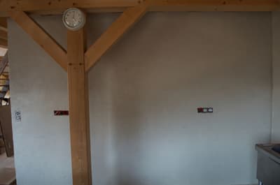 Architectural project - wood wall, rustic interior, wooden details, countryside feel, unfinished space, utility room, farmhouse aesthetic, natural materials, wood, timber, warm tones, neutral tones, under construction, exposed beams, structural support, beige, brown, Scandinavian influence, compact space, farmhouse style, simple design, rustic vibe, rustic charm, traditional building, wood structure, eco home, plaster, structural element, timber interior, open plan, natural texture, plaster finish, cozy atmosphere, sustainable material, beige wall, renovation, minimalist interior, remodel
