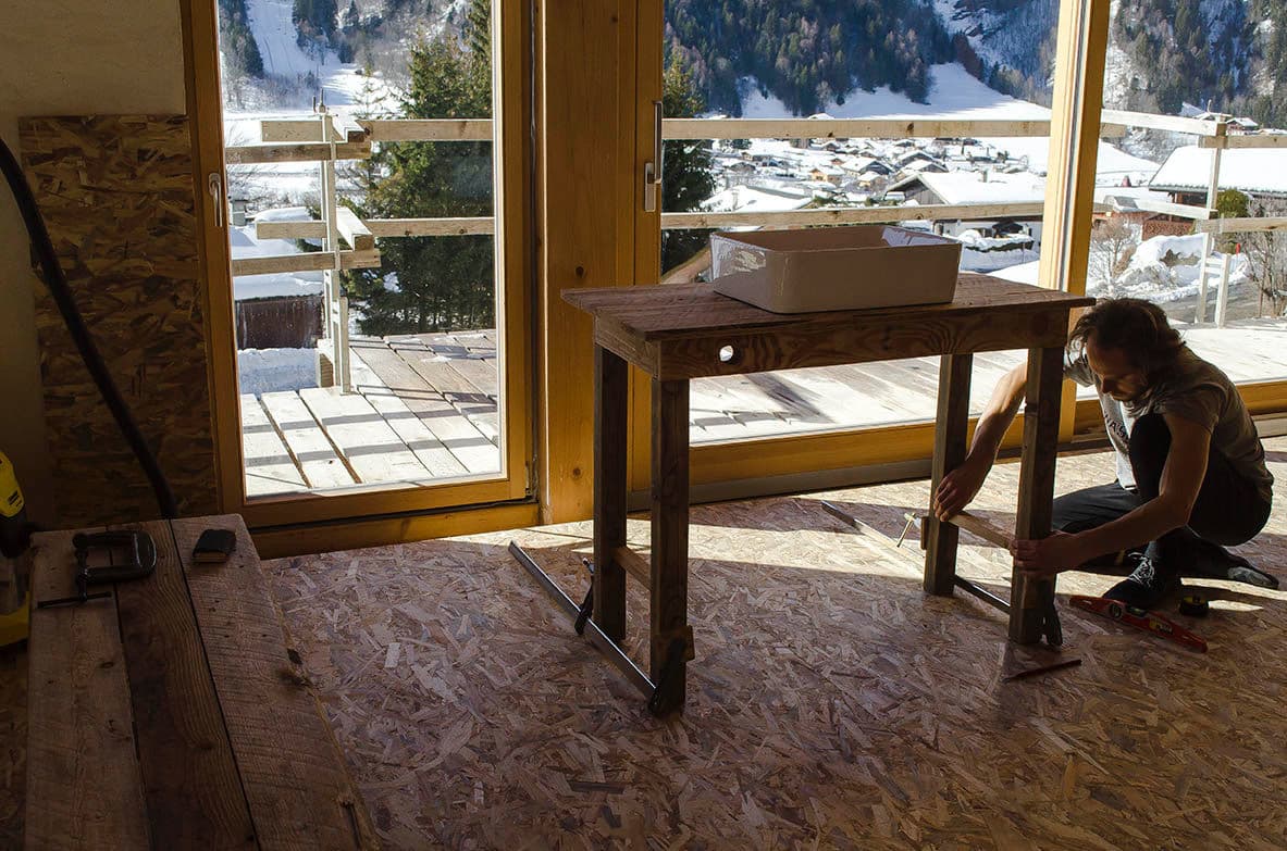 Architectural project - mountain view, scenic backdrop, DIY project, OSB board, balcony view, creative workspace, wood, timber, raw materials, natural light, sustainable design, warm tones, neutral tones, construction site, work in progress, carpentry, daylight, plywood, beige, brown, light wood, eco friendly, rustic vibe, honey wood, natural textures, timber floor, cozy space, exposed wood, rustic finish, large windows, indoor outdoor, timber cladding, wood cladding, wooden table, open space, wood flooring, renovation, wood interior
