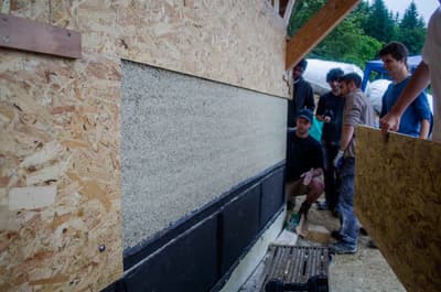 Architectural project - thermal insulation, community building, OSB board, OSB, wood building, carbon neutral, sustainable insulation, natural materials, wood, timber, recycled materials, natural tones, green building, neutral tones, construction site, outdoor construction, construction process, beige, exterior wall, low carbon design, building process, sustainable building, eco construction, circular construction, eco home, passive house, eco friendly home, energy efficient, environmentally friendly, timber framing, wooden structure, straw insulation, natural insulation, participatory design, collaborative building, wood panel, natural finishes