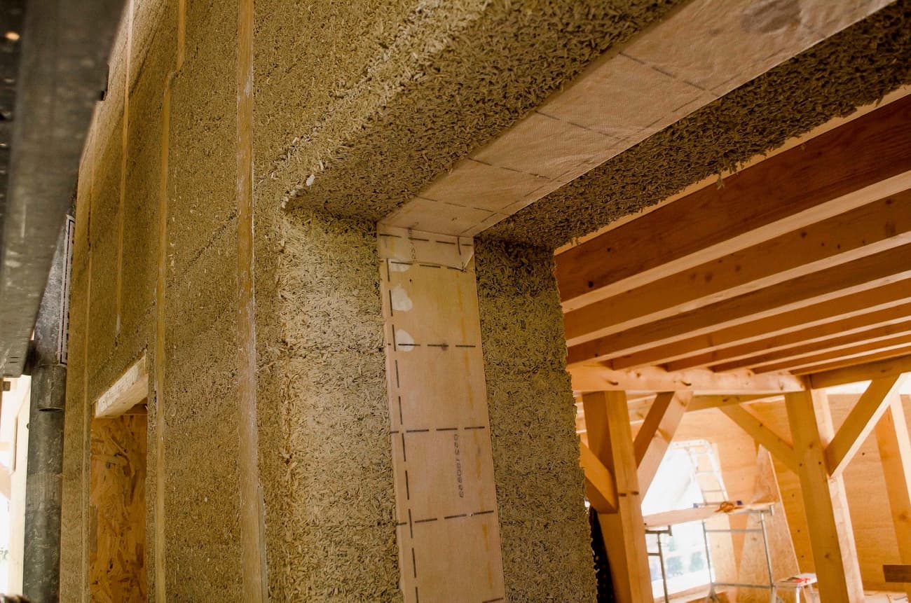 Architectural project - raw aesthetics, masonry, rustic building, unfinished space, natural materials, architectural detail, eco-friendly design, wood, timber, timber frame, sustainable design, warm tones, green building, exposed structure, renewable materials, construction phase, work in progress, industrial vibe, building site, beige, wooden beams, natural textures, neutral palette, eco materials, wood construction, low carbon construction, sustainable building, eco construction, natural building, passive house, energy efficient, plaster, earthy tones, organic materials, structural elements, natural insulation, construction