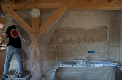 Architectural project - unfinished wall, exposed beam, interior construction, construction tools, natural materials, sustainable materials, wood, scaffolding, raw materials, timber frame, natural tones, construction site, under construction, plywood, structural support, industrial vibe, beige, timber construction, rustic vibe, wood construction, building process, sustainable building, eco construction, construction detail, earth tones, textured wall, plaster wall, plaster, structural element, wall texture, construction, renovation, home renovation