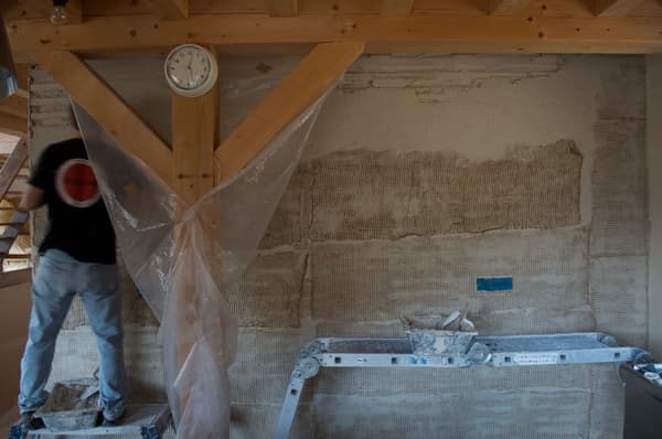 Architectural project - unfinished wall, exposed beam, interior construction, construction tools, natural materials, sustainable materials, wood, scaffolding, raw materials, timber frame, natural tones, construction site, under construction, plywood, structural support, industrial vibe, beige, timber construction, rustic vibe, wood construction, building process, sustainable building, eco construction, construction detail, earth tones, textured wall, plaster wall, plaster, structural element, wall texture, construction, renovation, home renovation