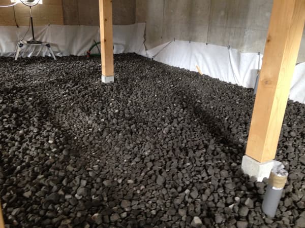 Architectural project - thermal insulation, timber columns, wood columns, renovation project, home building, indoor space, wood, timber, grey tones, natural tones, construction phase, structural support, industrial vibe, construction materials, structural engineering, building site, concrete, residential construction, eco construction, building foundation, groundwork, foundation work, energy efficient design, gravel, concrete wall