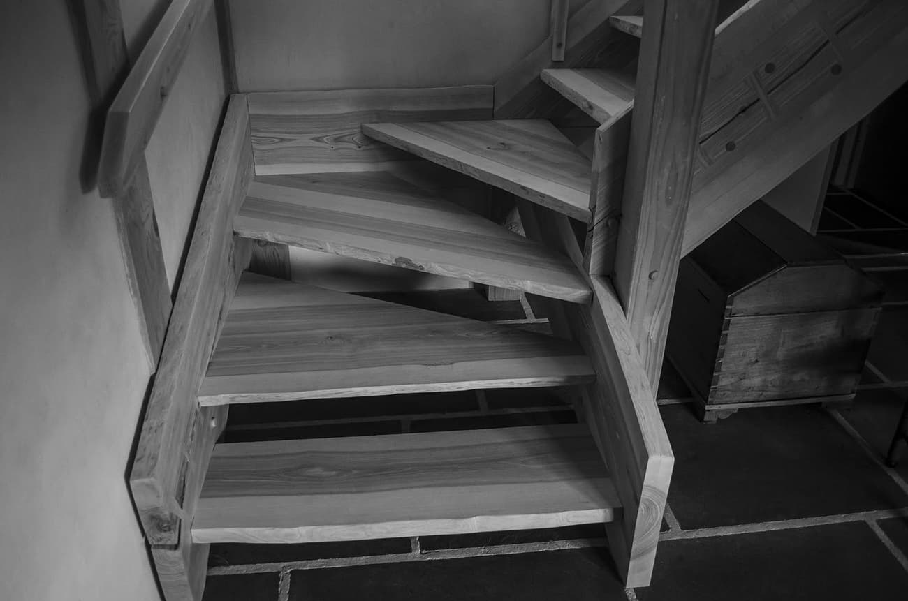 Architectural project - space-saving, rustic interior, homely feel, wooden steps, quiet space, rustic stairs, wood stairs, wood, timber, sustainable design, natural tones, grey, neutral tones, beige, natural textures, neutral palette, minimalist design, eco-friendly materials, natural material, cozy vibe, stone, small space, warm atmosphere, traditional style, stone floor, cottage style, interior space, timber design, artisan craftsmanship, stairwell
