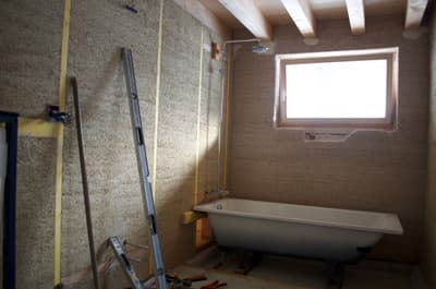 Architectural project - unfinished look, natural bathroom, rustic bathroom, cozy bathroom, small bathroom, earthy walls, bathroom, bathtub, indoor space, natural materials, sustainable materials, wood, timber, timber frame, natural light, eco design, sustainable construction, green building, neutral tones, construction site, work in progress, exposed beams, beige, light wood, eco friendly, compact space, wooden beams, rustic vibe, natural textures, ecological design, passive house, cozy vibe, energy efficient, timber ceiling, rustic style, earthy tones, textured walls, warm light, warm vibe, raw finish, wood ceiling, wooden accents, renovation, skylight, home renovation, remodel