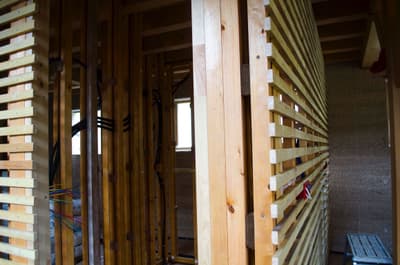 Architectural project - exposed timber, construction elements, wooden framework, linear pattern, unfinished space, architectural structure, framework, natural materials, wood, timber, raw materials, timber frame, natural light, warm tones, sustainable construction, timber structure, construction site, under construction, modern construction, daylight, structural design, light wood, modern aesthetic, honey wood, minimalist architecture, contemporary design, minimalist design, wood construction, building process, eco building, timber elements, structural wood, exposed wood, construction detail, timber architecture, timber cladding, wood cladding, beige tones, eco architecture, wooden slats, vertical slats, architectural rhythm