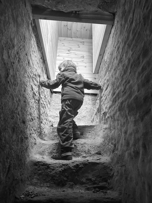 Architectural project - exposed stone, timeless style, rustic materials, historic vibe, heritage style, moody lighting, atmospheric space, rustic staircase, weathered stone, historical architecture, monochrome, intimate space, grey tones, natural light, organic texture, warm tones, neutral tones, simple design, rustic charm, cozy vibe, stone, cozy nook, timber ceiling, stonework, traditional design, child friendly, heritage building, textured walls, wood ceiling, skylight, black and white, stone texture