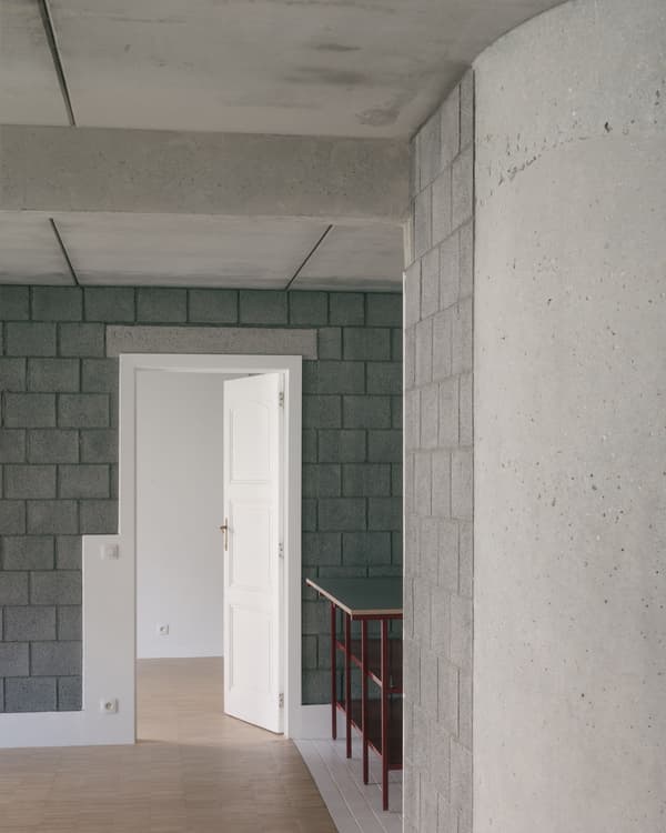 Architectural project - exposed concrete, urban feel, unfinished look, modern renovation, open doorway, transitional space, industrial, white door, concrete interior, cement block wall, gray wall, modular block, interior threshold, minimal vibe, concrete aesthetic, brutalist design, structural simplicity, clean transition, architectural concept, unique wall texture, light ambiance, cement, raw, minimalist, architectural detail, grey tones, raw materials, grey, neutral tones, functional space, concrete, geometric pattern, modern aesthetic, industrial style, minimalist design, contemporary home, clean lines, white, textured wall, open plan, residential space, neutral, modern interior
