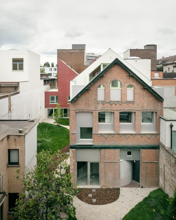 Architectural project - urban greenery, urban residence, city garden, urban terrace, modern renovation, contemporary extension, traditional meets modern, contrasting materials, rooftop terrace, arched windows, inner city house, glass sliding doors, courtyard view, compact footprint, dense housing, architectural blend, facade preservation, historic meets modern, smart renovation, light-filled interior, context sensitive, heritage conservation, architectural heritage, sustainable urban home, layered design, city courtyard, city living, cityscape, outdoor space, sustainable design, glass, urban landscape, grey, neutral tones, concrete, urban oasis, private retreat, adaptive reuse, large windows, white, plaster, pitched roof, brick, brick facade, red brick, heritage building, garden view, gable roof, seamless integration, urban architecture, green roof, eco conscious design, architectural contrast, dynamic facade, mixed materials, townhouse, urban charm, red