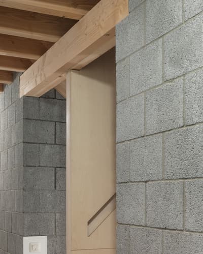 Architectural project - raw concrete, open ceiling, unfinished look, ceiling detail, structural expression, cinder blocks, structural contrast, grey concrete, brutalist elements, loft vibe, monochrome palette, material contrast, raw aesthetics, natural materials, architectural detail, wood, timber, natural tones, grey, neutral tones, exposed beams, beige, concrete, industrial style, wooden beams, timber beams, contemporary design, minimalist design, industrial chic, construction detail, rustic texture, modern rustic, concrete blocks, clean lines, textured wall, wood texture, simple lines