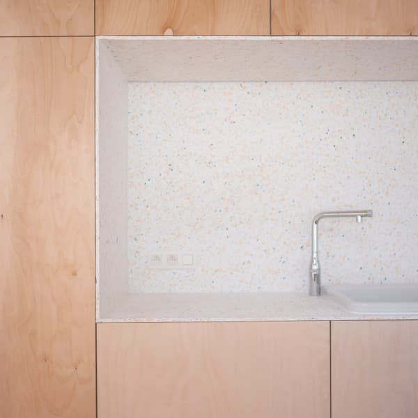 Architectural project - contemporary kitchen, neutral kitchen, Japandi influence, apartment kitchen, inviting, integrated sink, built-in sink, chrome, kitchen nook, urban kitchen, pastel tones, wood, timber, metal, natural light, sustainable design, daylight, beige, light wood, natural wood, functional design, eco friendly, compact space, simple design, Scandinavian style, calming space, cozy space, clean lines, white, Nordic design, home kitchen, warm vibe, minimalist kitchen, modern kitchen, wood cabinetry, timber cabinetry, bright space, soft tones, small kitchen, sleek faucet, practical layout