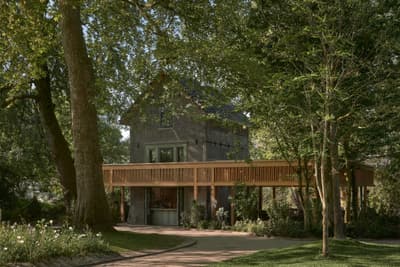 Architectural project - secluded spot, garden house, integration with nature, countryside style, shaded area, rural aesthetics, wraparound deck, scenic retreat, wood deck, wood, timber, outdoor living, passive design, sustainable design, warm tones, green, timber structure, beige, brown, eco friendly, natural setting, rustic charm, wood construction, tranquil setting, natural landscape, biophilic design, stone, earthy tones, tree canopy, rustic facade, treehouse, peaceful escape, nature retreat, forest view, timber deck, forest hideaway, woodland cabin, nature immersion, cozy exterior, eco retreat, garden path, lush greenery, green surroundings
