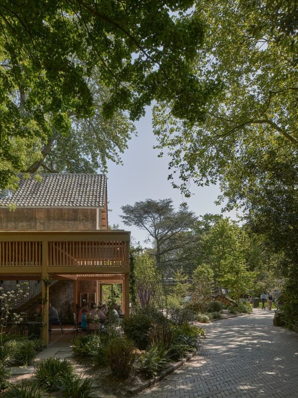 Architectural project - scenic backdrop, garden pavilion, plant life, peaceful garden, relaxing atmosphere, brick path, harmonious space, serene vibe, natural materials, eco-friendly design, wood, timber, outdoor space, timber frame, natural light, outdoor living, passive design, natural tones, sustainable architecture, green, beige, brown, tranquil setting, wood structure, ecological design, biophilic design, nature-inspired, brick, landscape design, natural environment, garden view, open air, earthy textures, lush greenery, wooden detailing, connection with nature